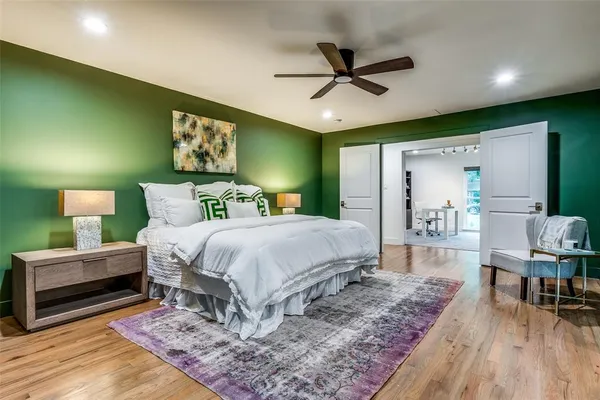 a bed room with a bed and a mirror