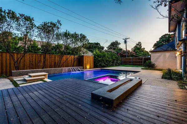 a view of a wooden deck with furniture