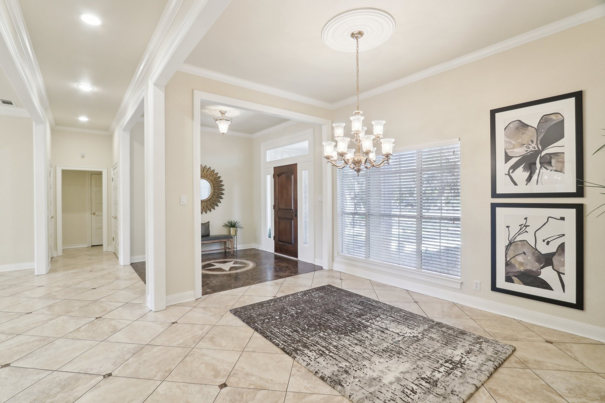 294 Logan Ranch Road Georgetown, TX 78628 - Photo 7 of 40 a view of a hallway with wooden floor and a chandelier