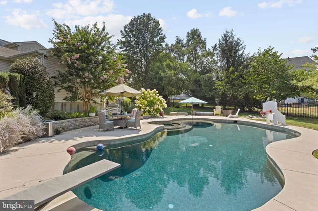 a view of a swimming pool with chairs