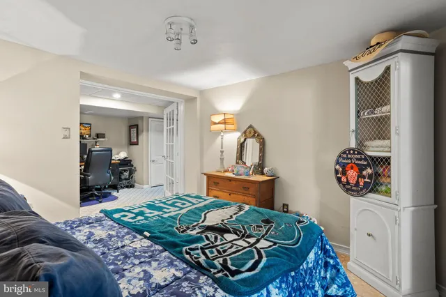 a bed room with a bed and a tv