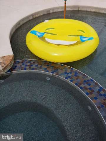 a view of a house with a yard porch and sitting area