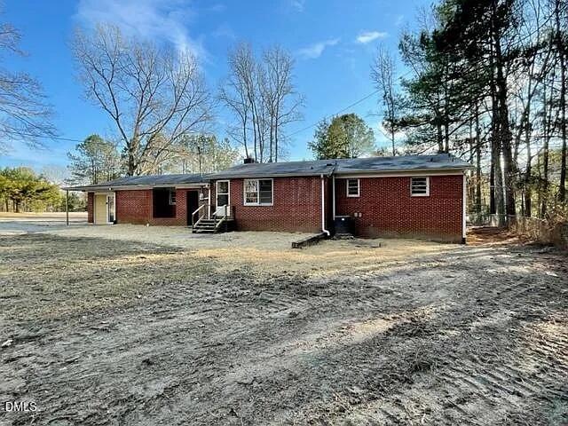 7 Noble Road Franklinton, NC 27525 - Photo 2 of 8 a front view of a house with a yard and garage