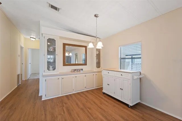 a large white kitchen with window
