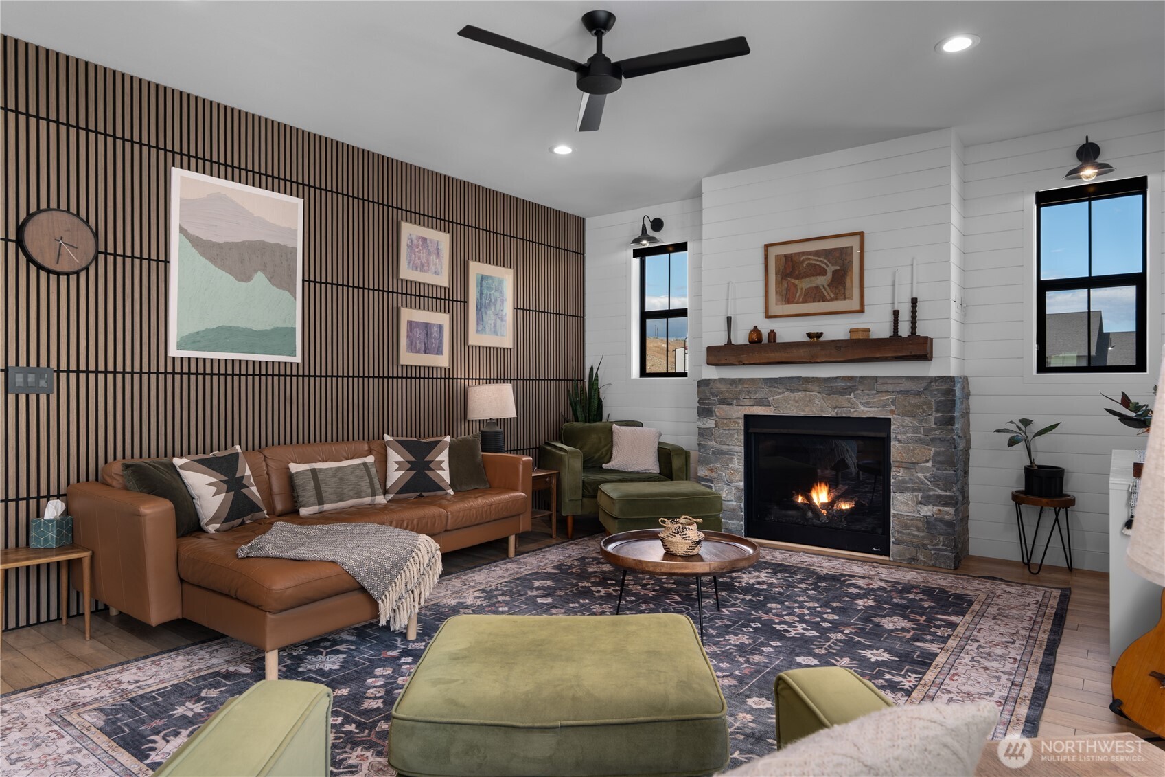 485 Hidden Lane Chelan, WA 98816 - Photo 12 of 40 a living room with furniture and a fireplace