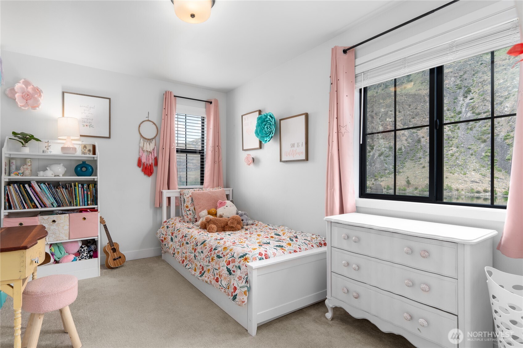 485 Hidden Lane Chelan, WA 98816 - Photo 22 of 40 a bedroom with a bed and a window