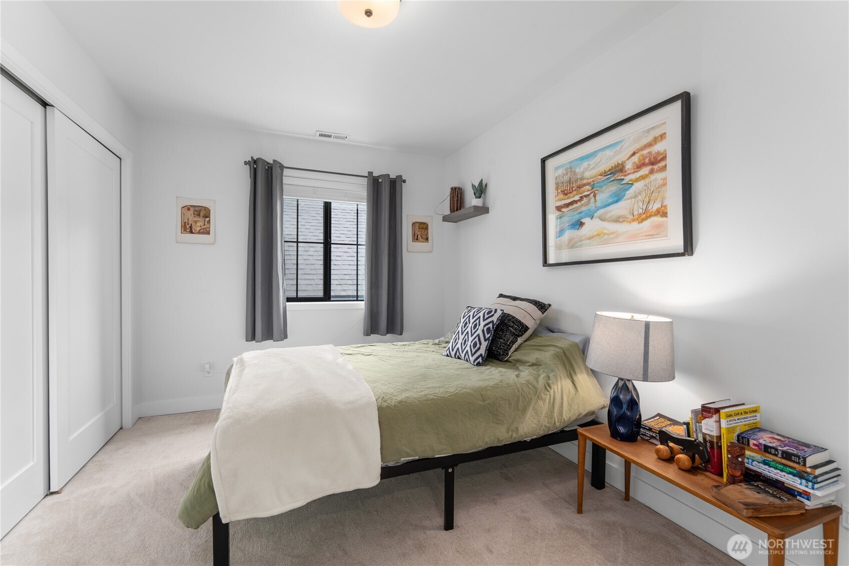 485 Hidden Lane Chelan, WA 98816 - Photo 23 of 40 a bedroom with a bed and a lamp on the dresser