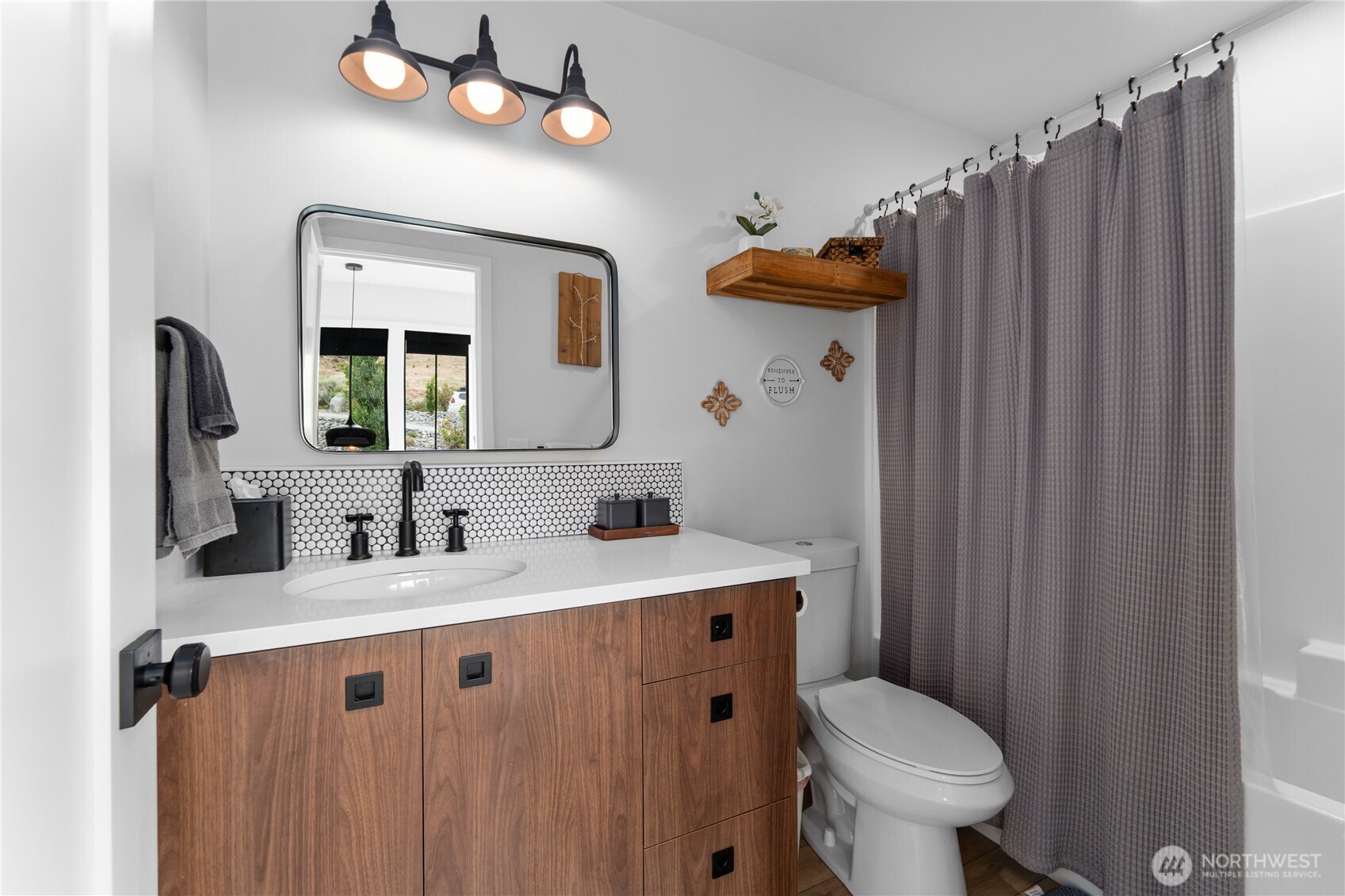 485 Hidden Lane Chelan, WA 98816 - Photo 24 of 40 a bathroom with a sink vanity mirror and toilet