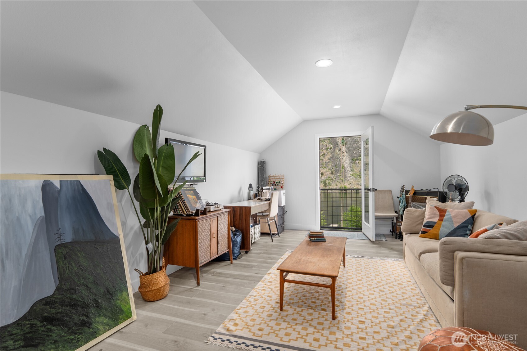 485 Hidden Lane Chelan, WA 98816 - Photo 29 of 40 a living room with furniture potted plant and a large window