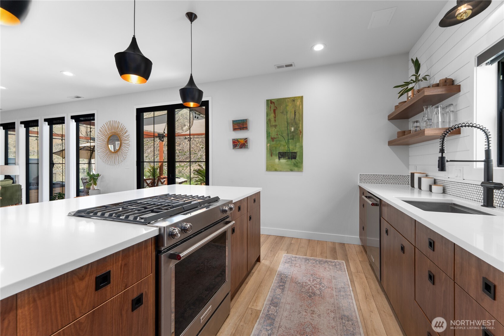 485 Hidden Lane Chelan, WA 98816 - Photo 8 of 40 a kitchen that has a sink a stove and a window