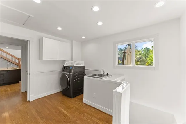 a kitchen with a refrigerator and a stove top oven