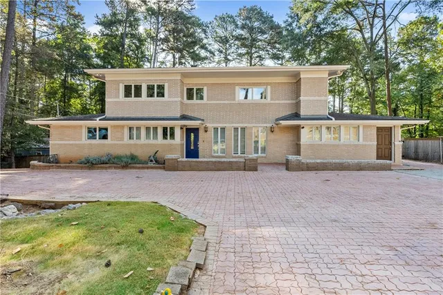 front view of a house with a yard