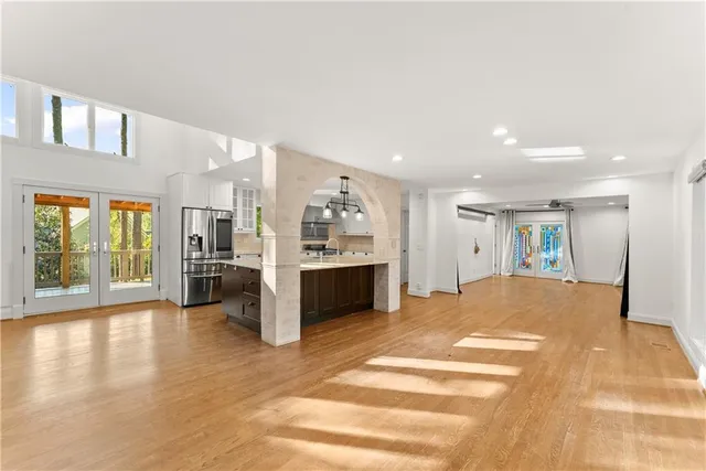 a view of a kitchen with a sink and a refrigerator
