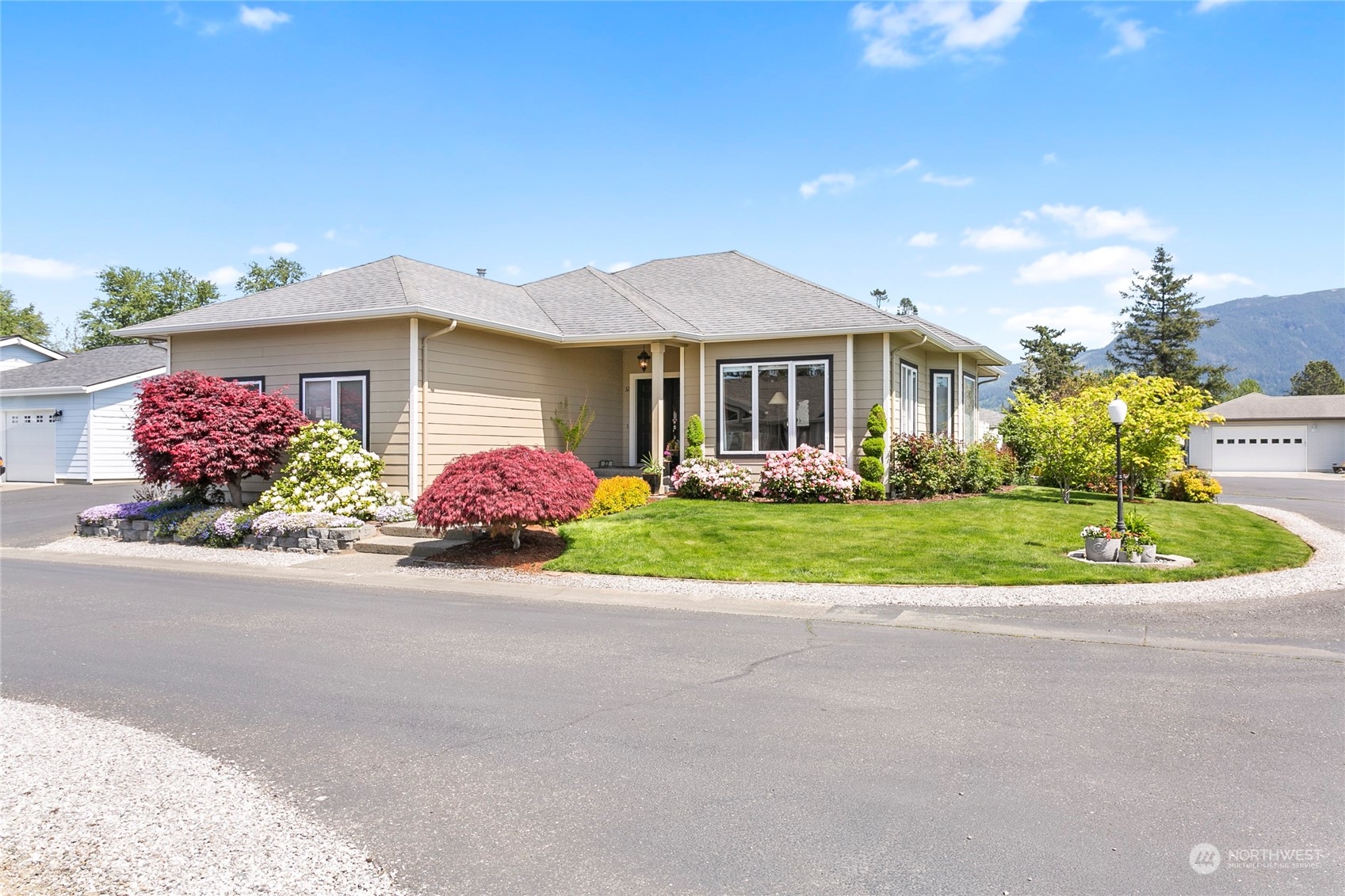 107 South Pass Road, Unit 32 Nooksack, WA 98276 - Photo 1 of 40 a front view of house with yard and green space