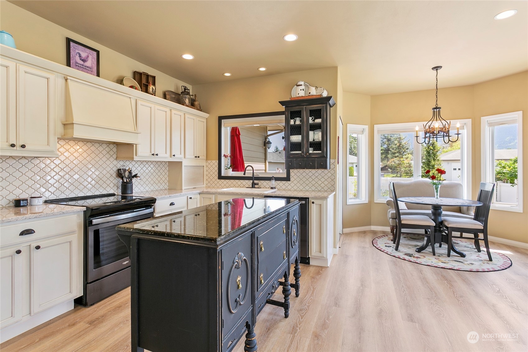 107 South Pass Road, Unit 32 Nooksack, WA 98276 - Photo 17 of 40 a kitchen with stainless steel appliances granite countertop a stove top oven a sink dishwasher and cabinets with wooden floor