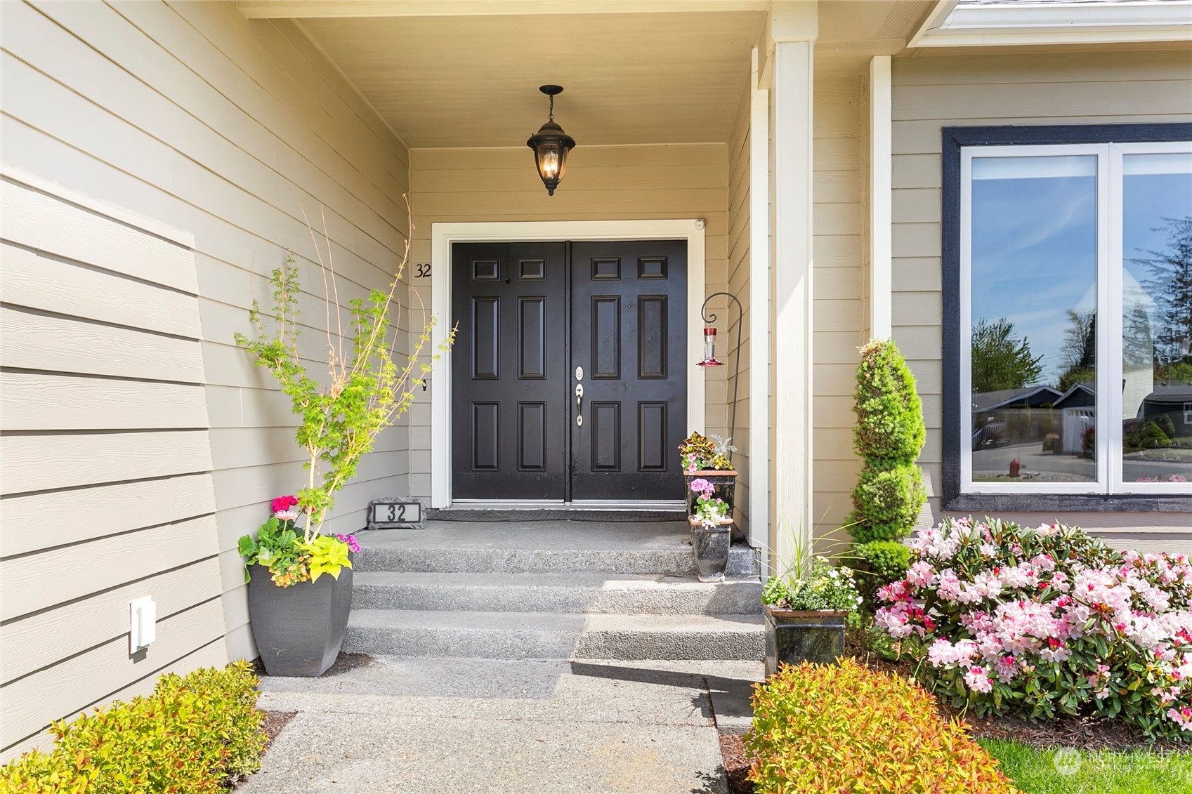 107 South Pass Road, Unit 32 Nooksack, WA 98276 - Photo 5 of 40 a front view of a house with outdoor seating