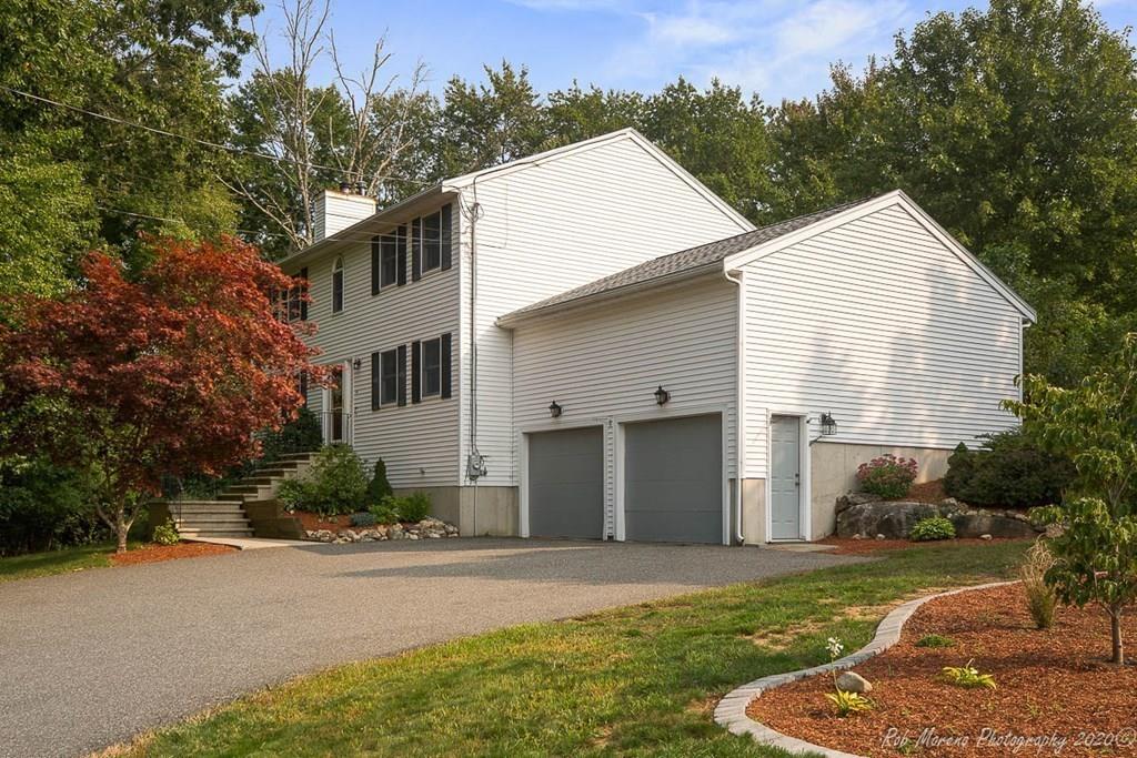 324 Linebrook Road Ipswich, MA 01938 - Photo 1 of 39 a view of a white house with a yard and large tree