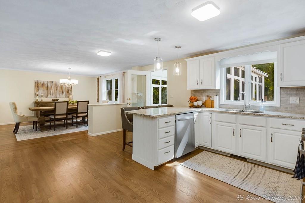 324 Linebrook Road Ipswich, MA 01938 - Photo 13 of 39 a kitchen with stainless steel appliances granite countertop a stove and cabinets