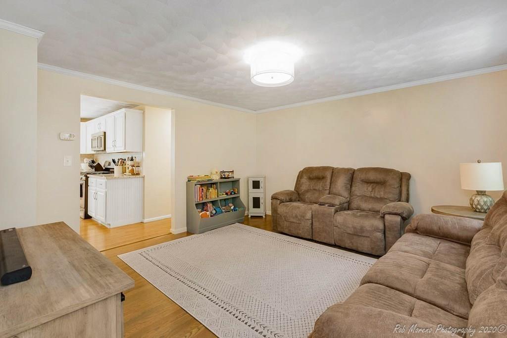 324 Linebrook Road Ipswich, MA 01938 - Photo 19 of 39 a living room with furniture and kitchen view