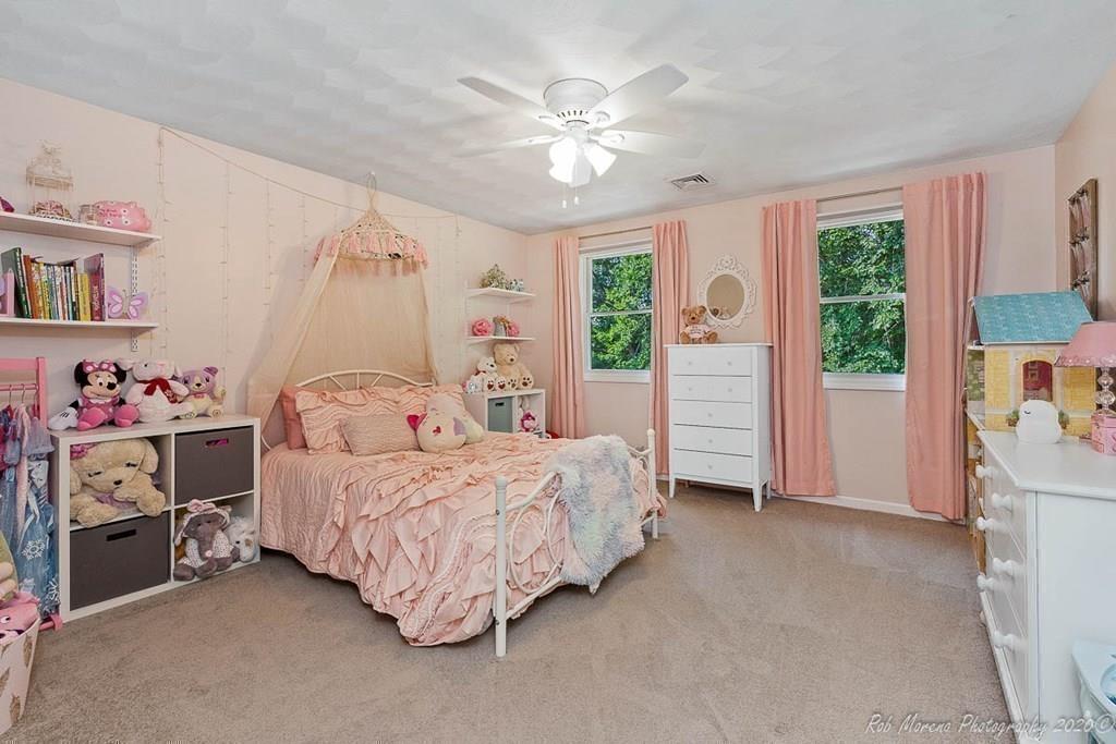 324 Linebrook Road Ipswich, MA 01938 - Photo 24 of 39 a bedroom with a bed and a window