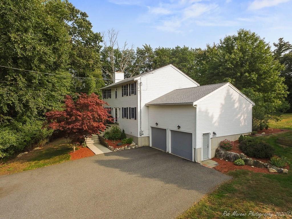 324 Linebrook Road Ipswich, MA 01938 - Photo 32 of 39 a view of a house with a yard and garage
