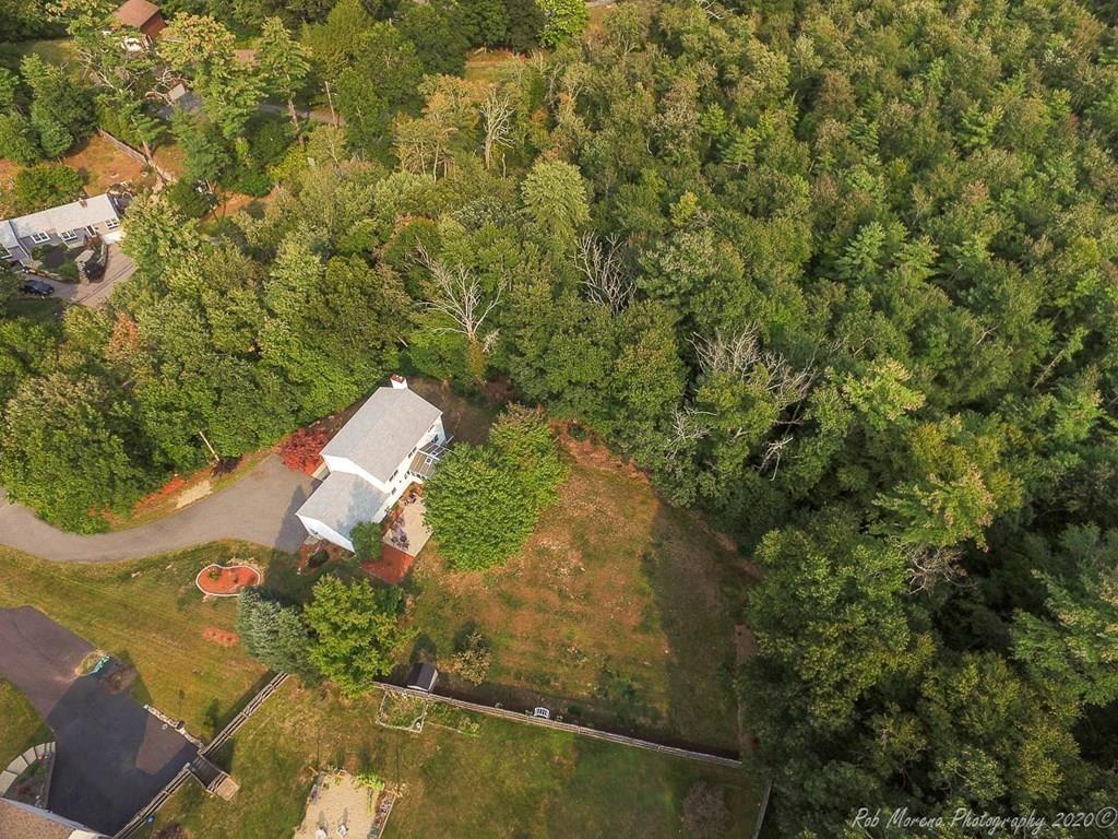 324 Linebrook Road Ipswich, MA 01938 - Photo 34 of 39 an aerial view of a house with a yard and trees