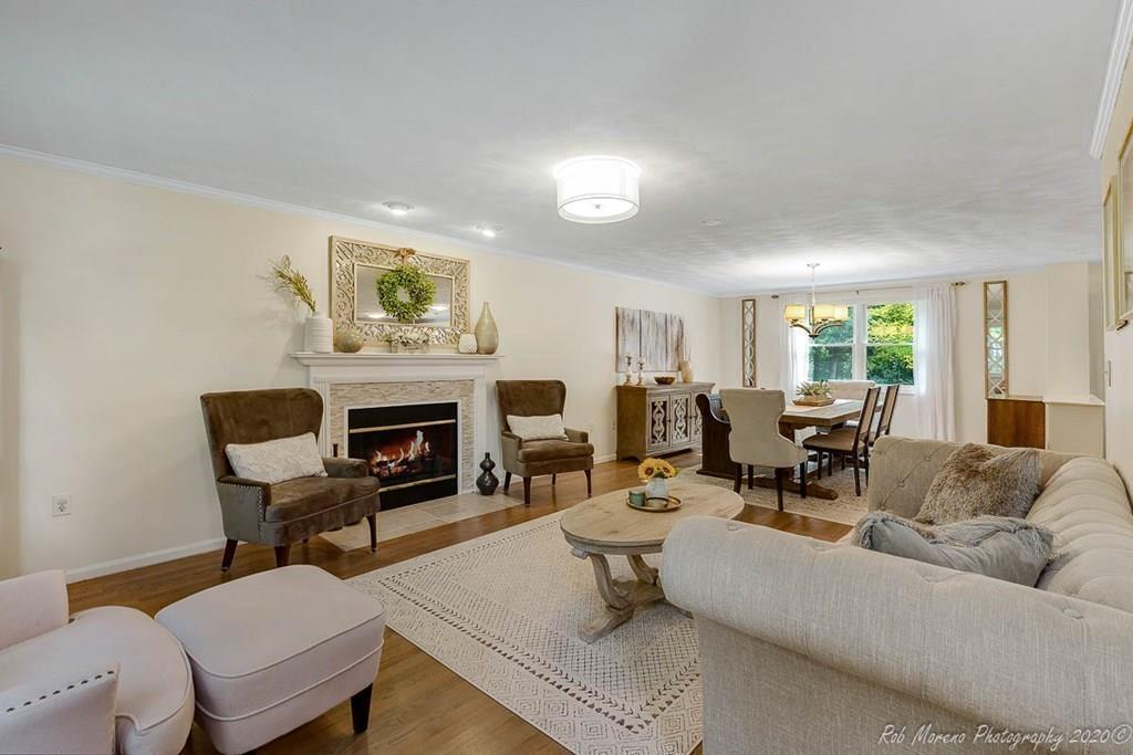 324 Linebrook Road Ipswich, MA 01938 - Photo 5 of 39 a living room with furniture and a fireplace