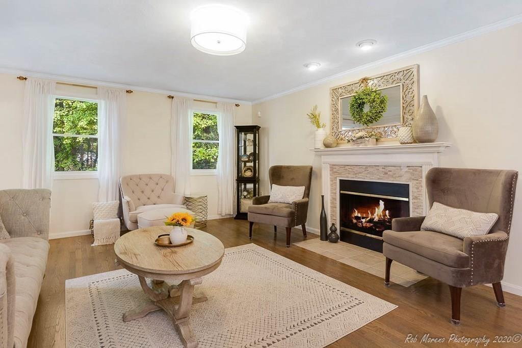324 Linebrook Road Ipswich, MA 01938 - Photo 7 of 39 a living room with furniture and a fireplace