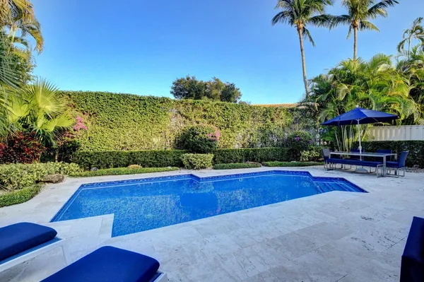a view of swimming pool with seating space