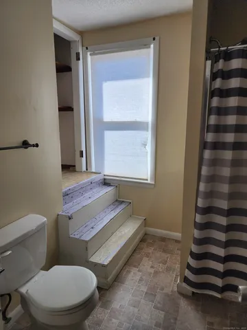 a bathroom with a toilet and a sink