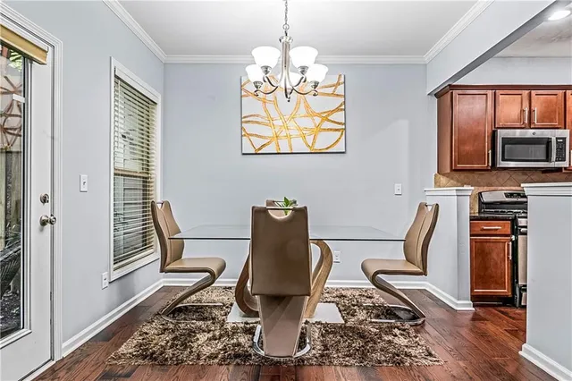 a view of empty room with wooden floor and fireplace