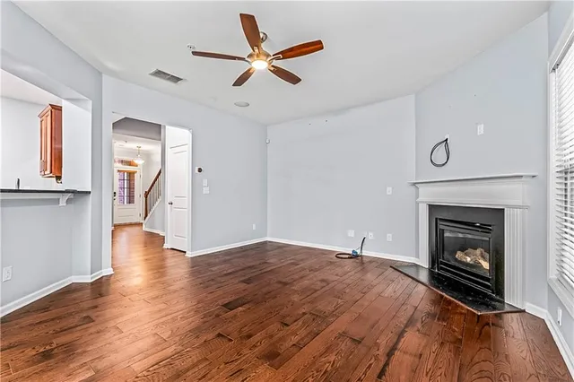 a kitchen with stainless steel appliances granite countertop a refrigerator a stove top oven a sink and dishwasher