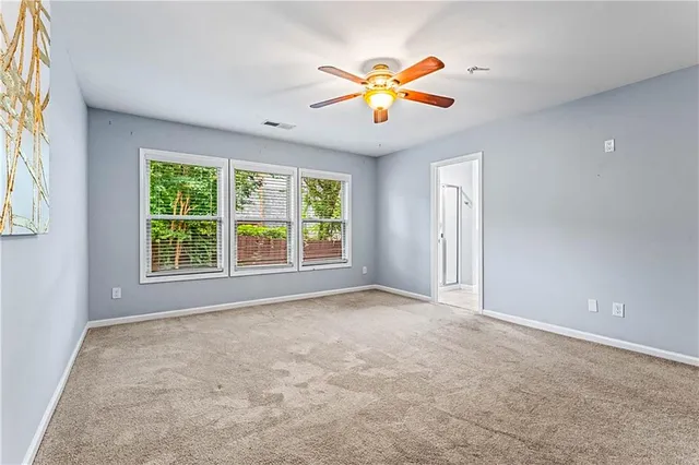 a bathroom with a tub sink shower and mirror