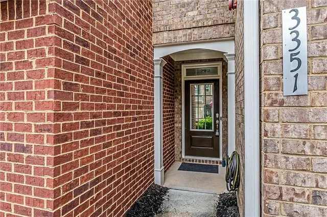 a backyard of a house with outdoor seating
