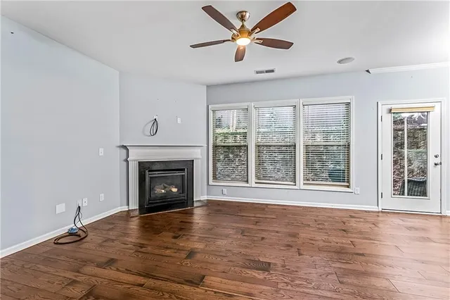 a view of a livingroom with furniture and a fireplace