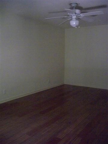 2706 Cole Street, Unit 104B Austin, TX 78705 - Photo 3 of 10 a view of a room with wooden floor and windows