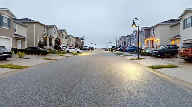 a view of a street with cars
