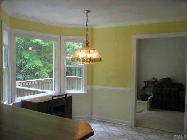 501 Chapwith Road Garner, NC 27529 - Photo 6 of 10 The breakfast area has a bay window with blinds, 2 piece chair rail and crown molding.