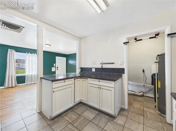 a kitchen with a sink and cabinets