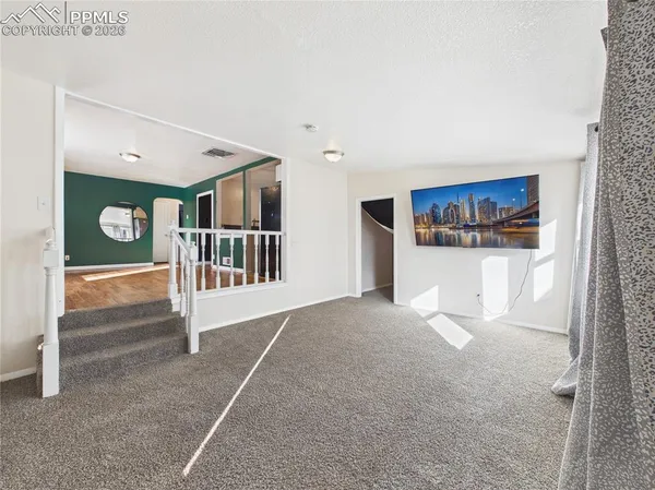a view of livingroom with furniture and stairs