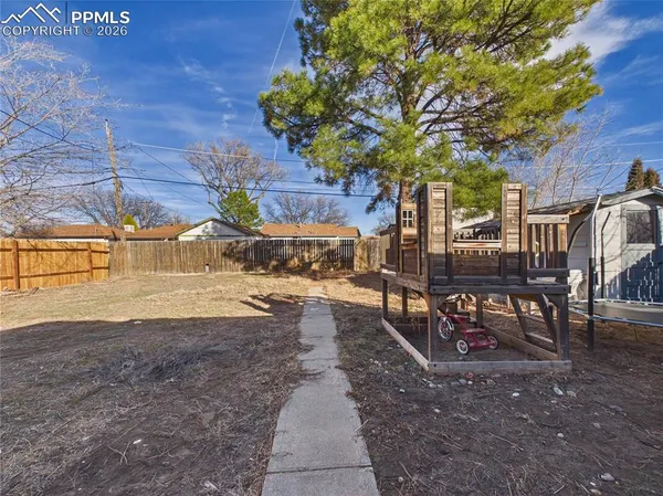 a view of yard with patio
