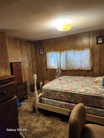 a bedroom with a bed and furniture