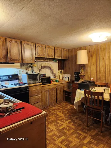 a kitchen with stainless steel appliances granite countertop a sink counter space and cabinets
