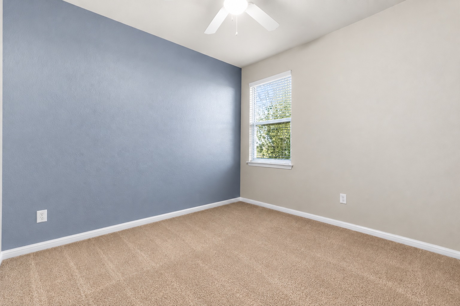 121 Guemal Road Buda, TX 78610 - Photo 10 of 13 Plush carpeted flooring and a large window define this versatile bedroom space.