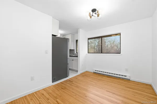 a view of a room with wooden floor and closet