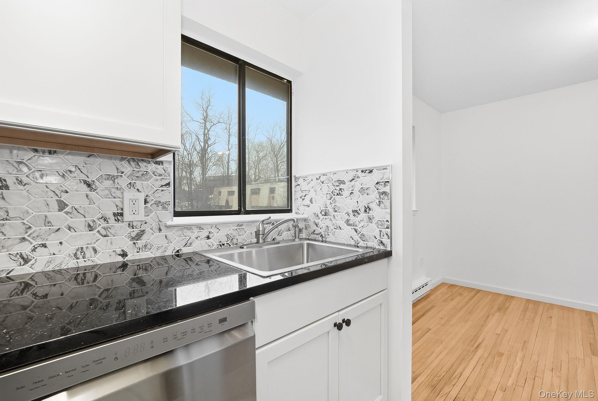 20 Pierces Road, Unit 36 Newburgh, NY 12550 - Photo 19 of 36 a bathroom with a sink and a large mirror