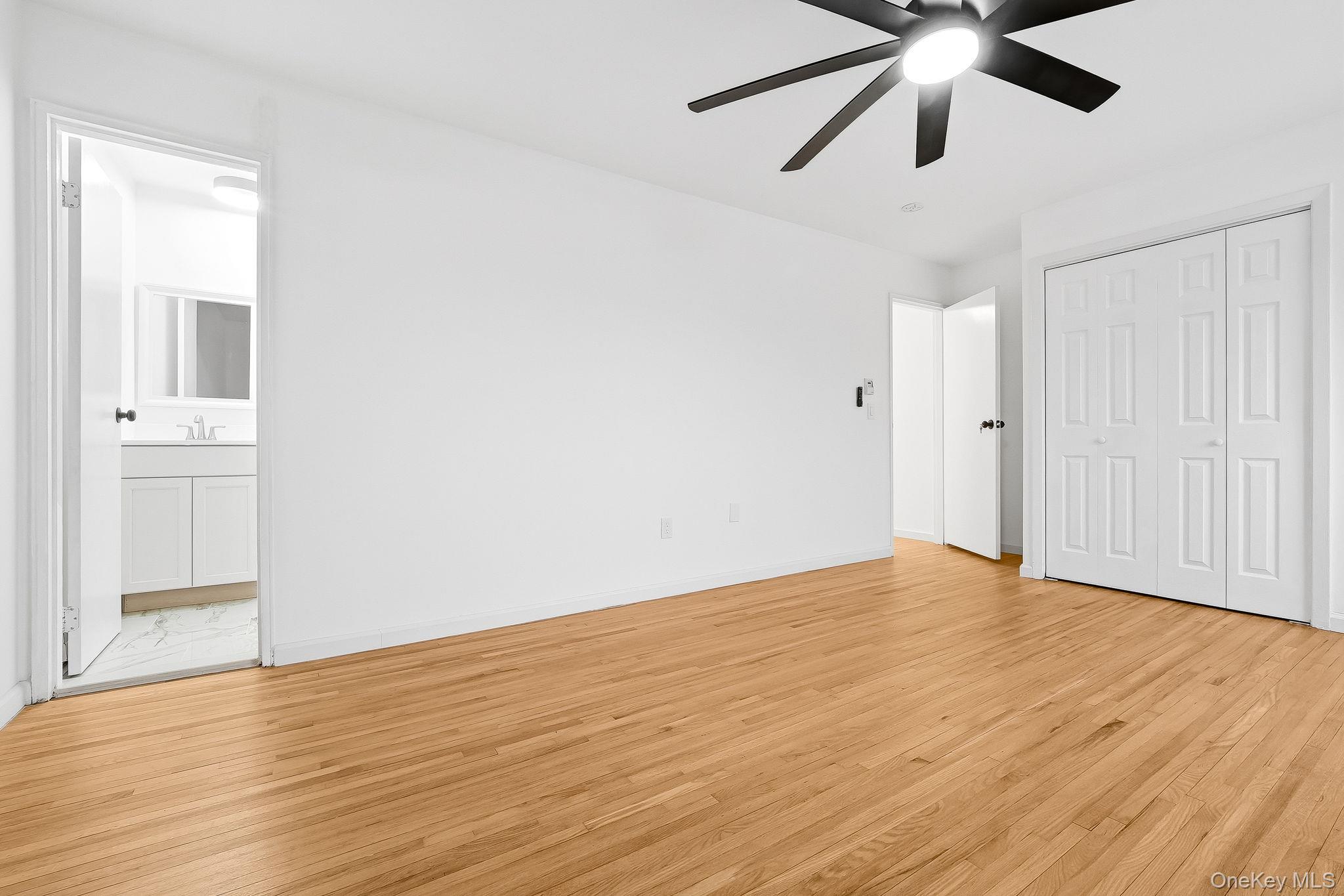 20 Pierces Road, Unit 36 Newburgh, NY 12550 - Photo 26 of 36 an empty room with wooden floor closet and ceiling fan