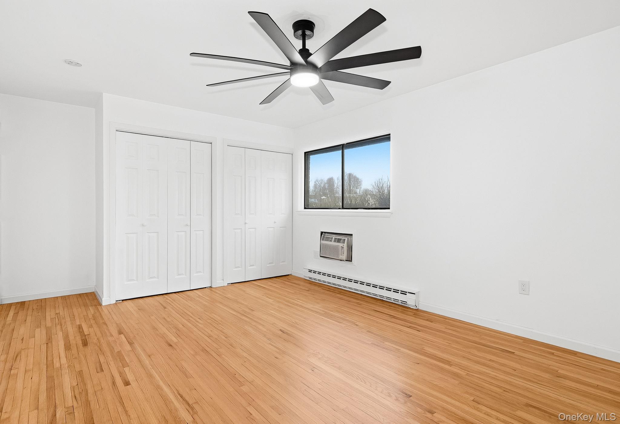 20 Pierces Road, Unit 36 Newburgh, NY 12550 - Photo 27 of 36 a view of empty room with wooden floor