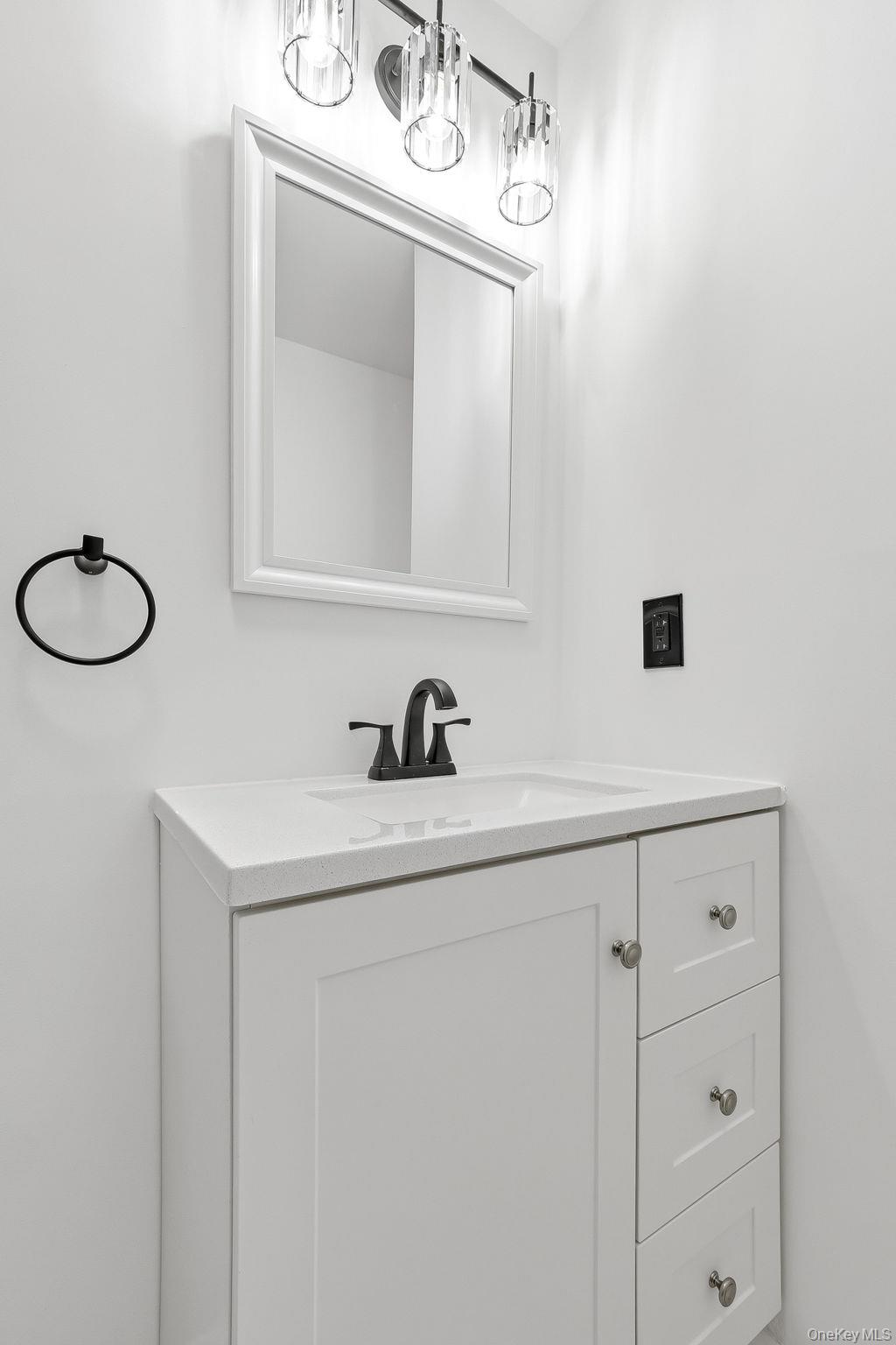 20 Pierces Road, Unit 36 Newburgh, NY 12550 - Photo 30 of 36 a bathroom with a sink and a mirror