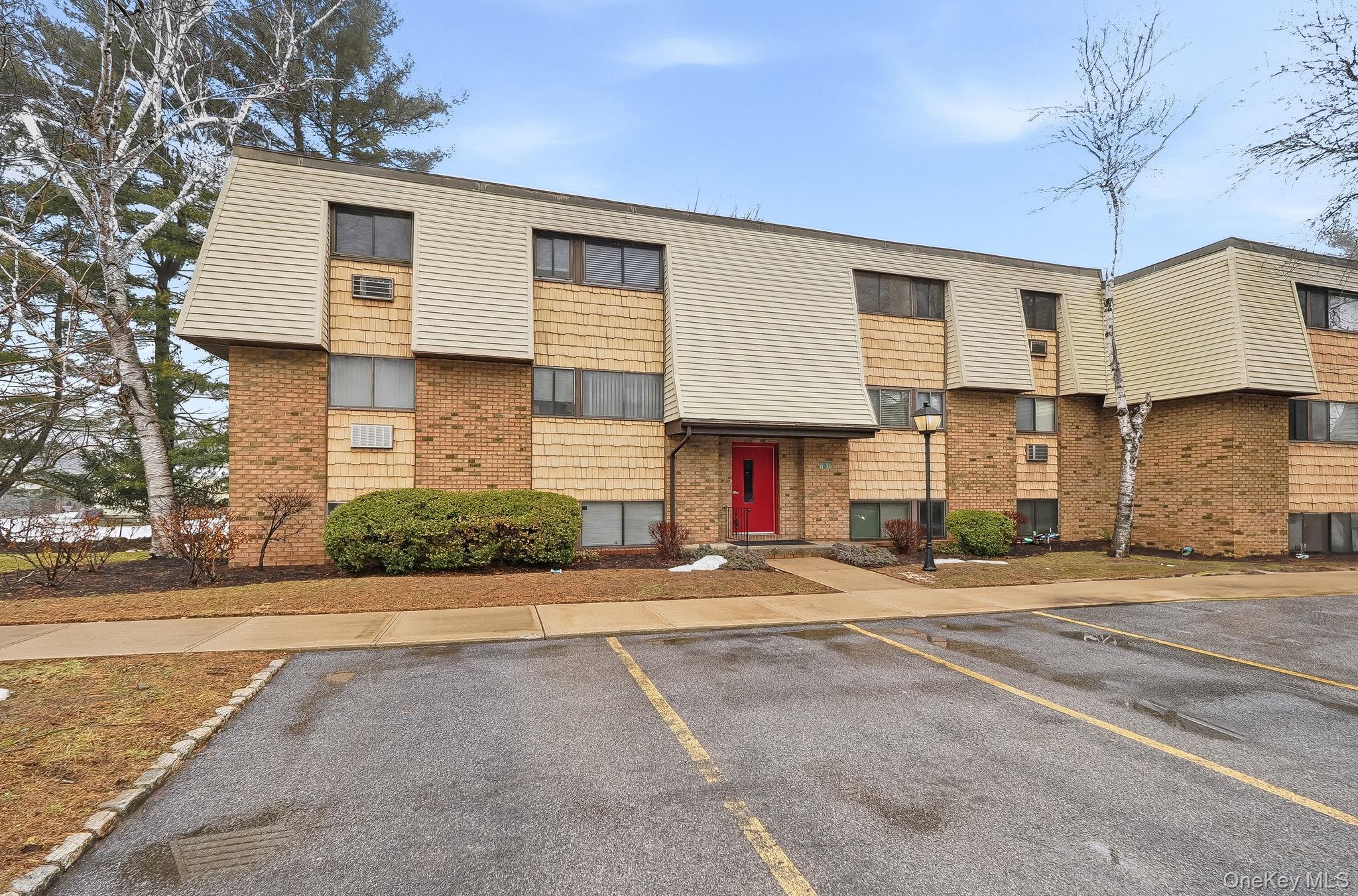 20 Pierces Road, Unit 36 Newburgh, NY 12550 - Photo 3 of 36 a front view of a house with a yard and garage